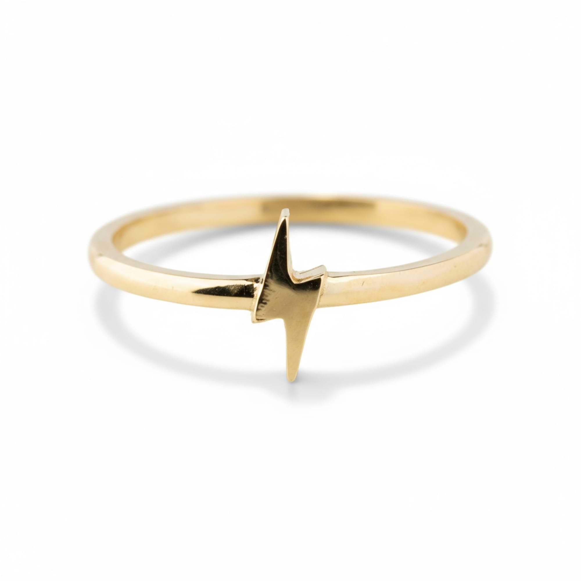 Gold ring with a star-shaped design on a white background