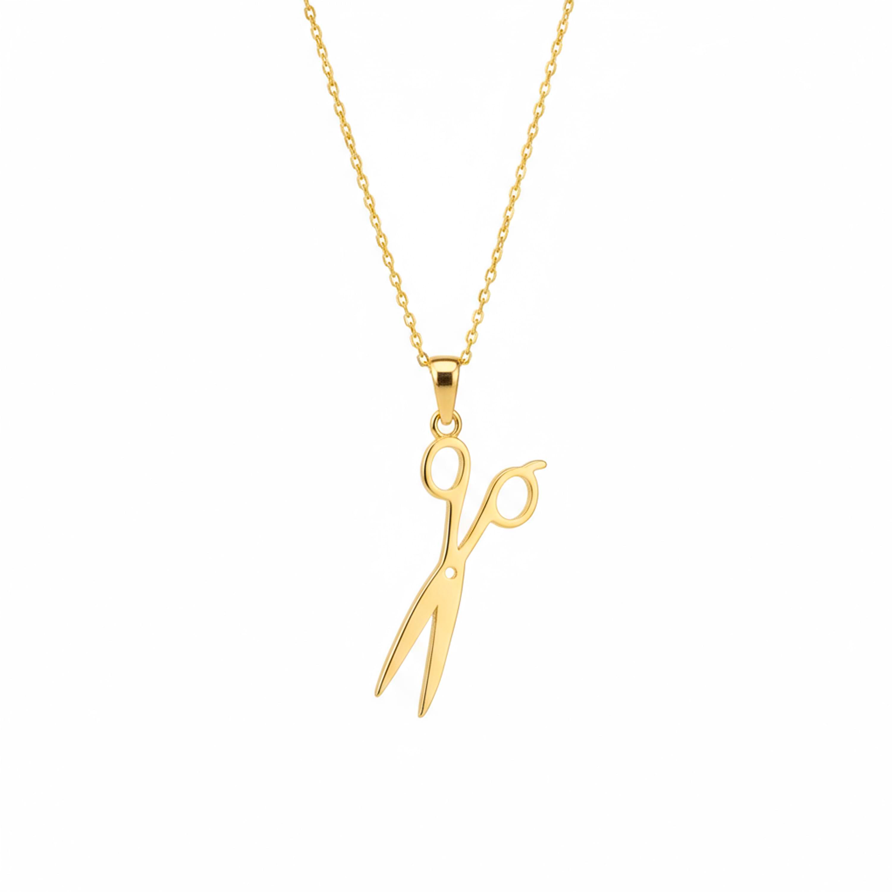 14k Gold scissors pendant necklace on a white background