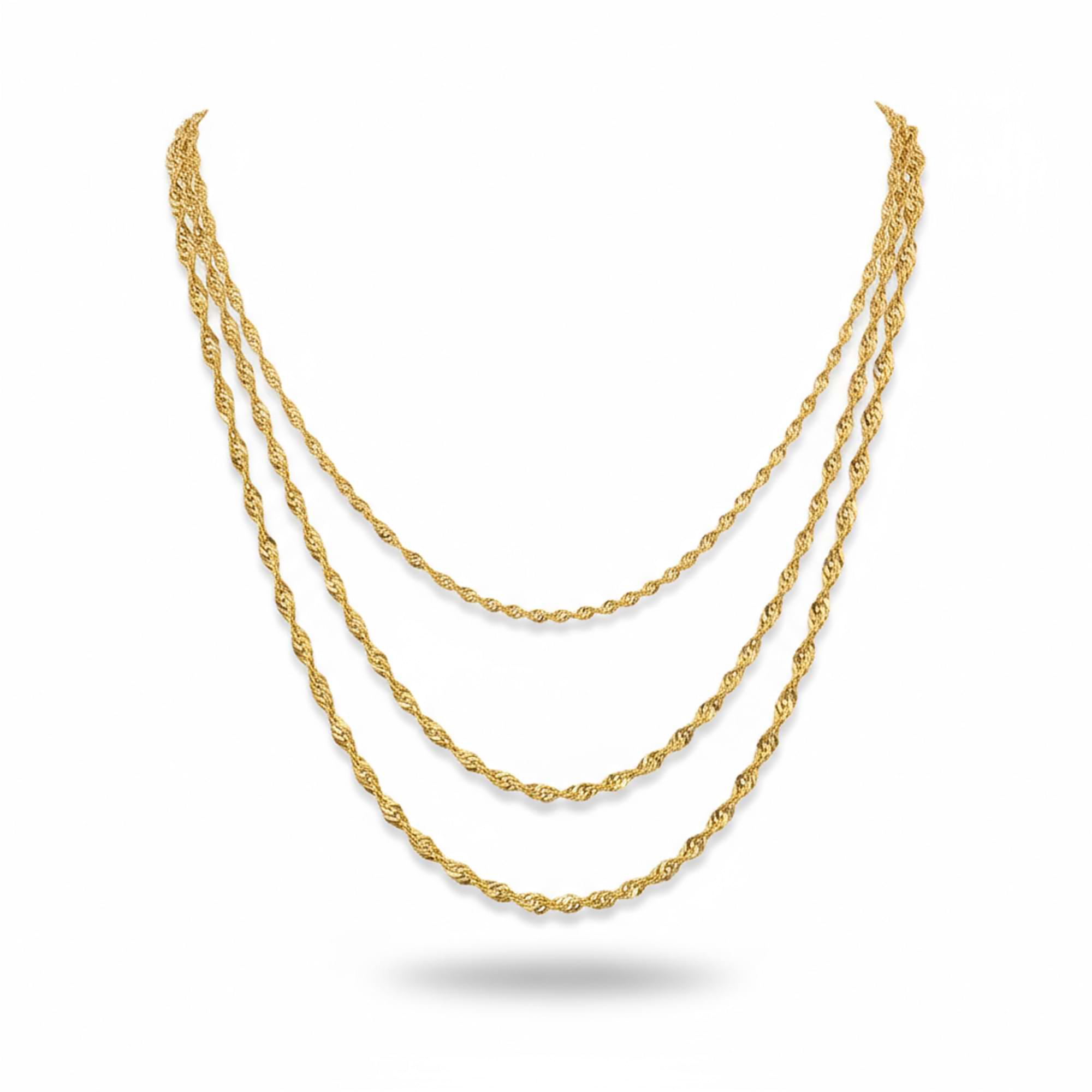 Three gold necklaces on a white background