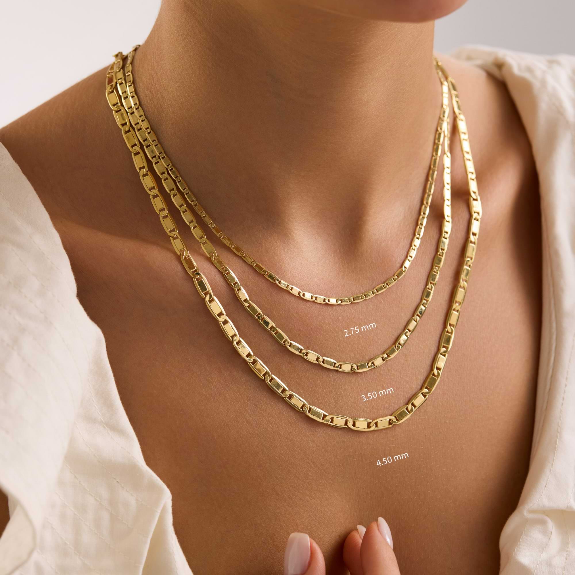 Gold valentino chain necklaces of different thicknesses on a woman's neck with measurements.