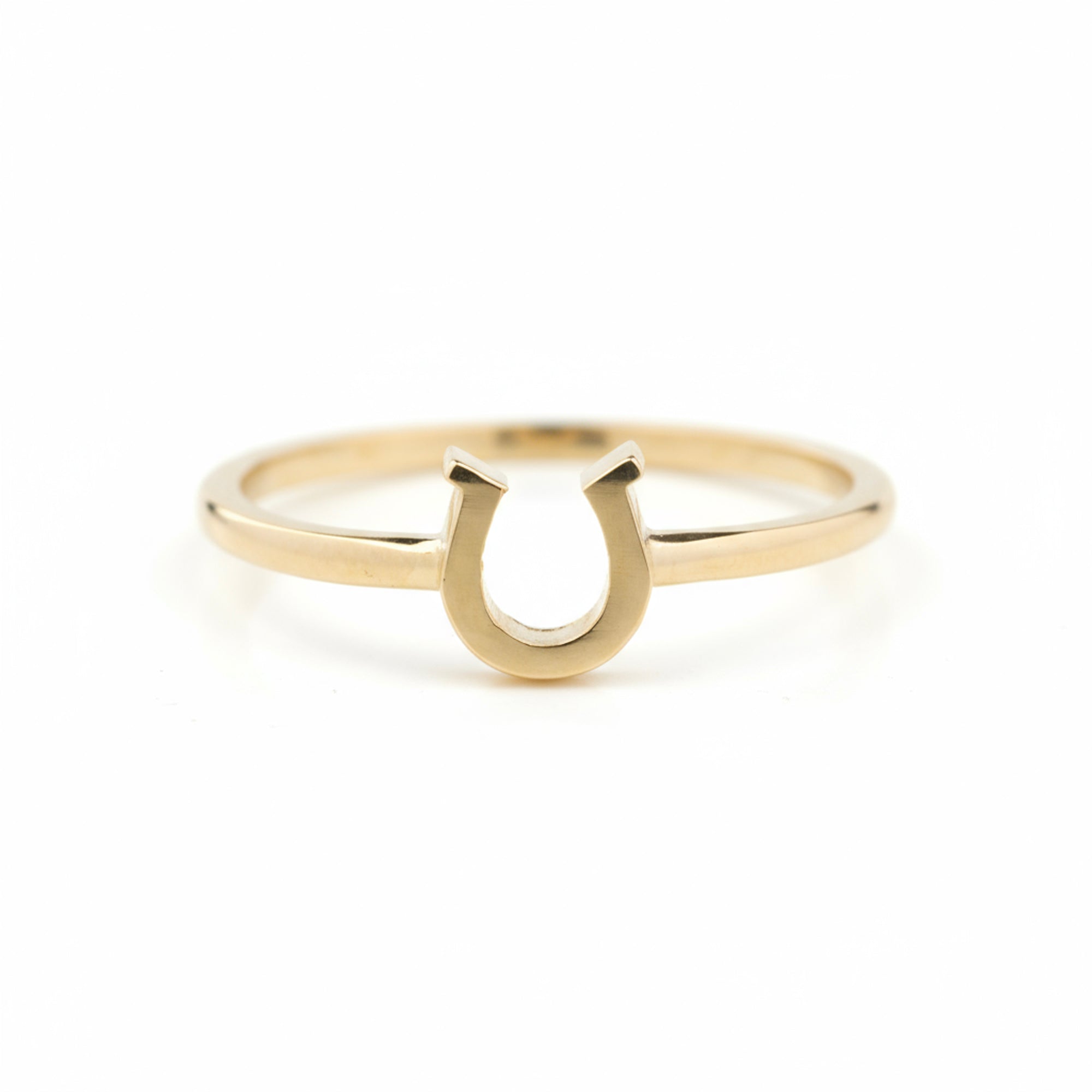 14k Gold ring with a horseshoe design on a white background