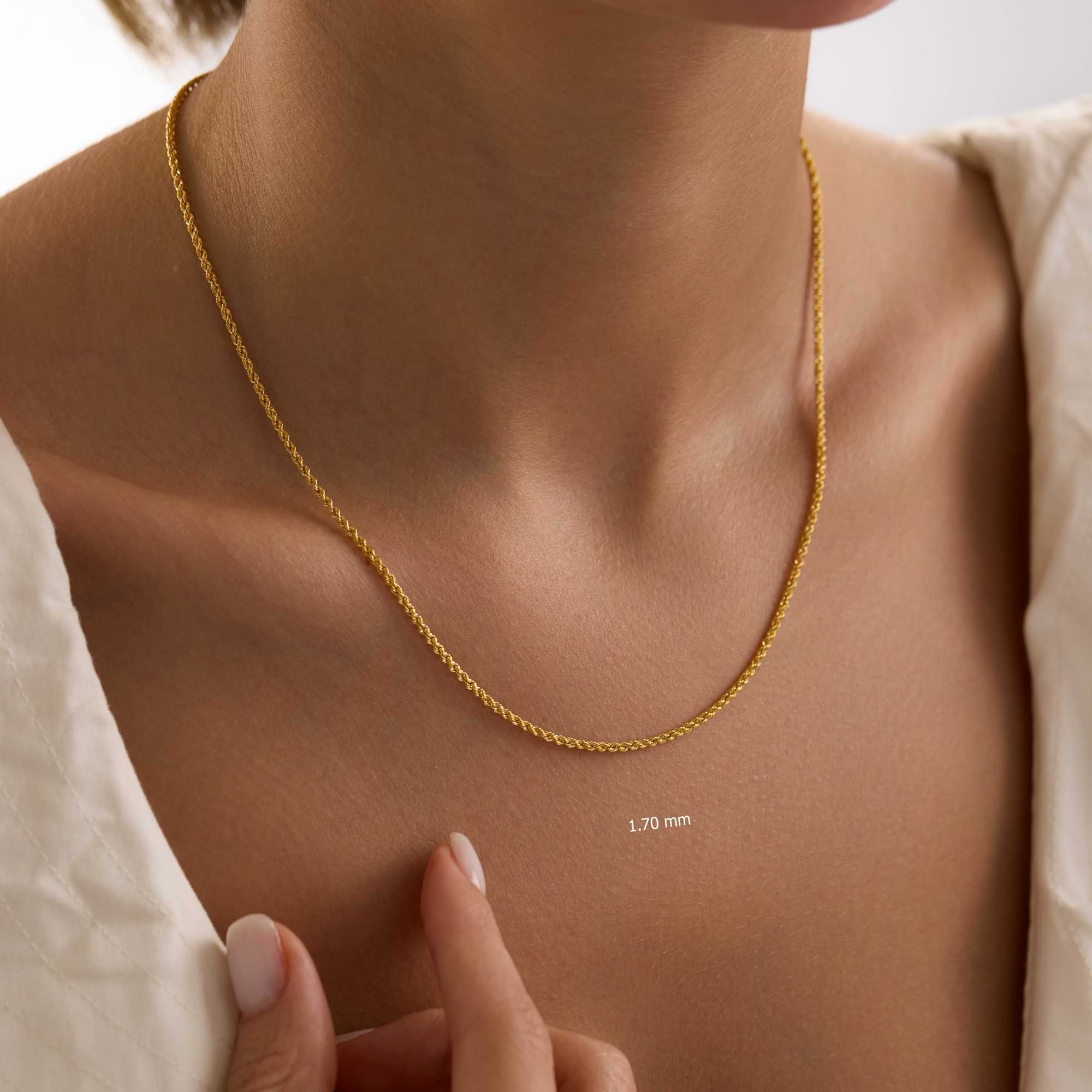 14k Gold 1.7mm rope chain necklace on a woman's neck