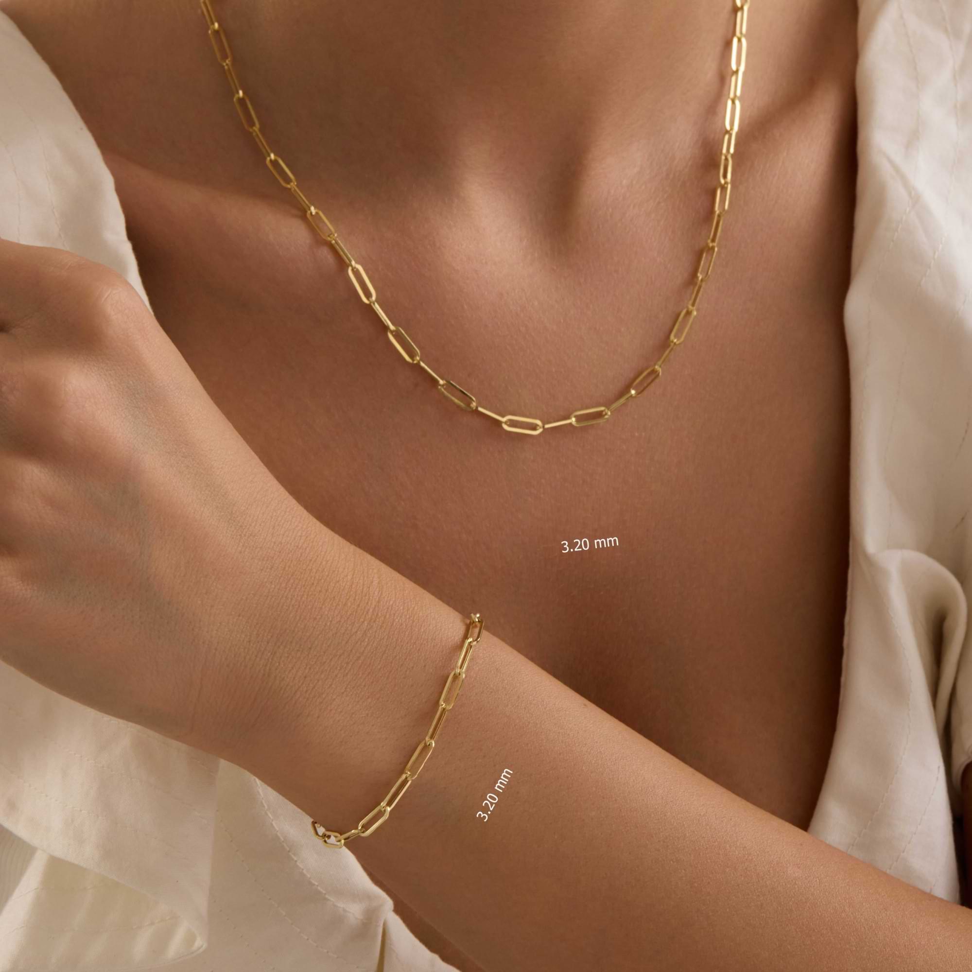 14k Gold 3.2mm Paperclip necklace and bracelet on a person's neck and wrist.