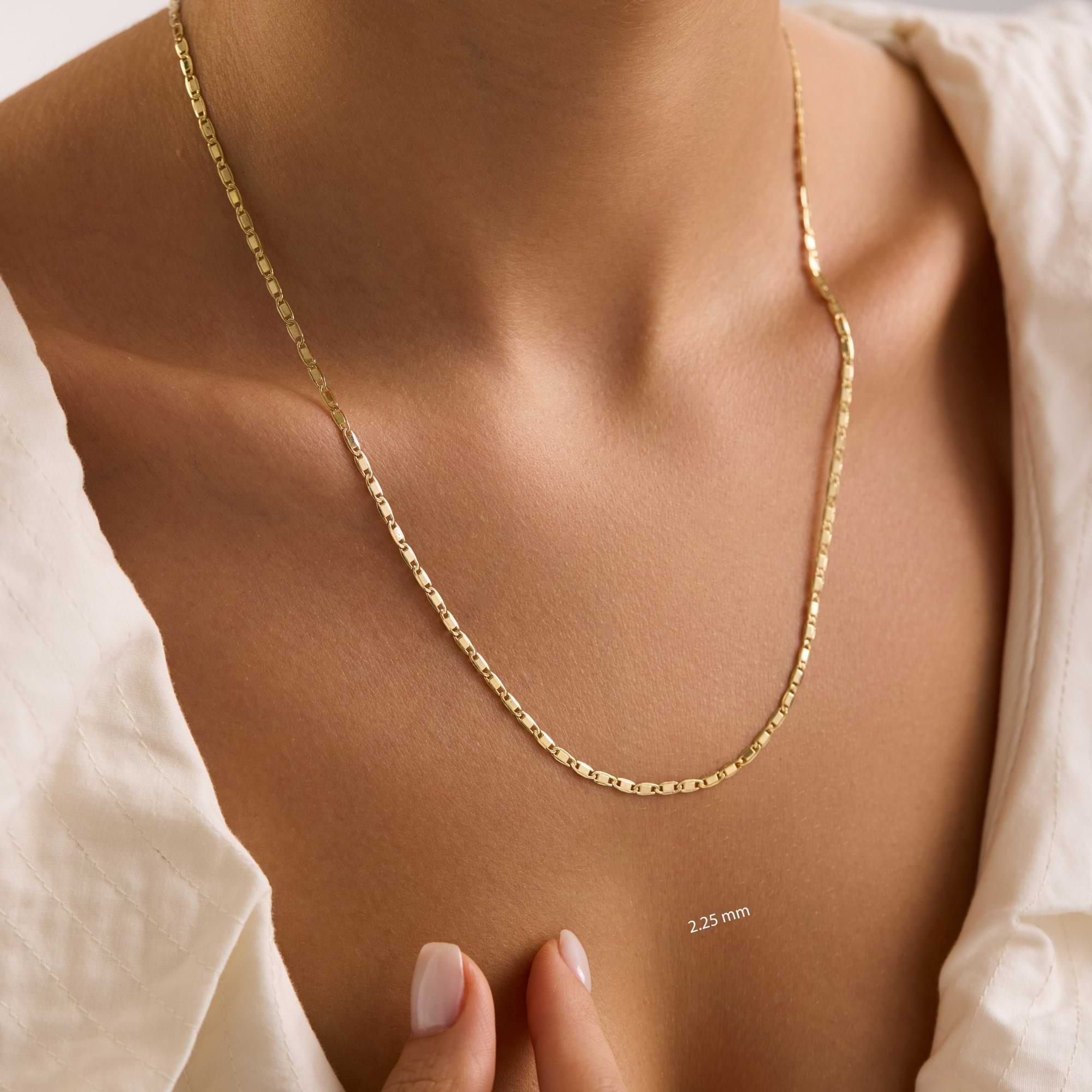 14k Gold 2.25mm valentino necklace on a woman's neck with a close-up of the chain detail.
