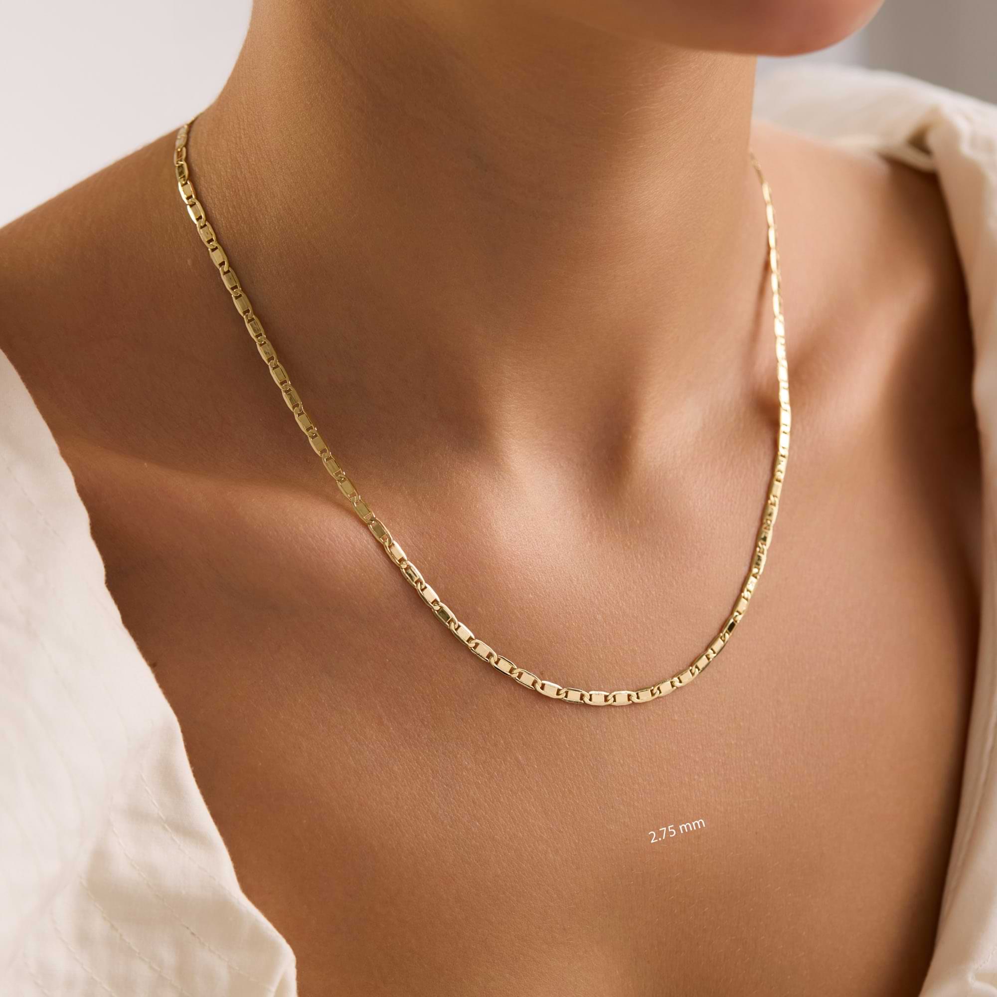 Gold 2.75mm valentino chain necklace on a woman with a neutral background