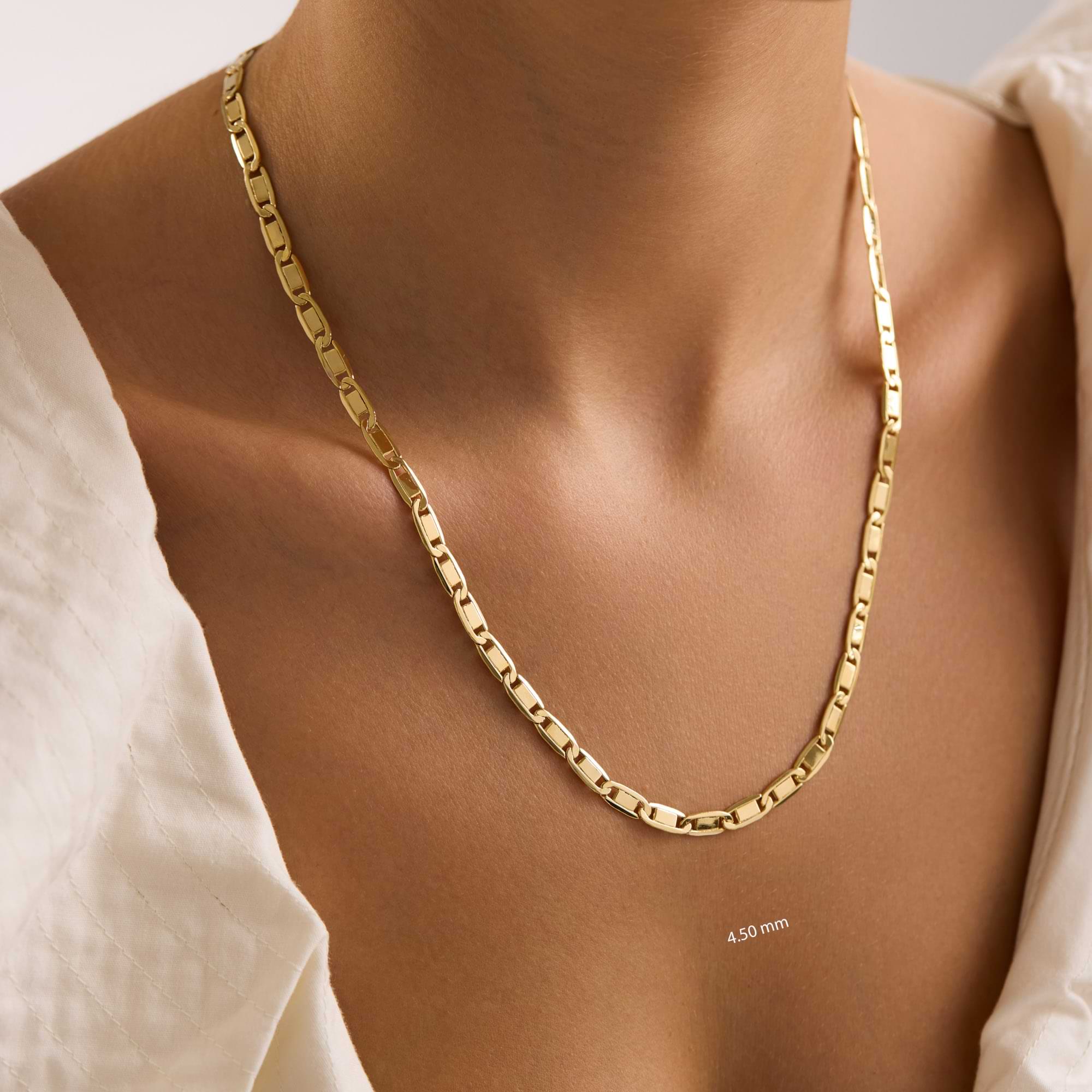 Gold 4.5mm valentino chain necklace on a woman with a neutral background
